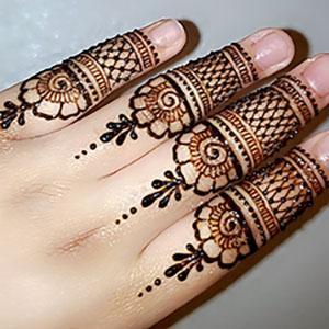 detailed henna design on fingers