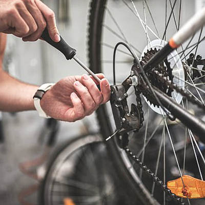 a close up screenshot of a cycle wheel being repaired