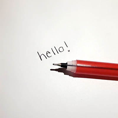 'Hello' written by a pen