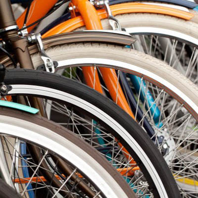 a zoomed in image of 4 bicycle wheels